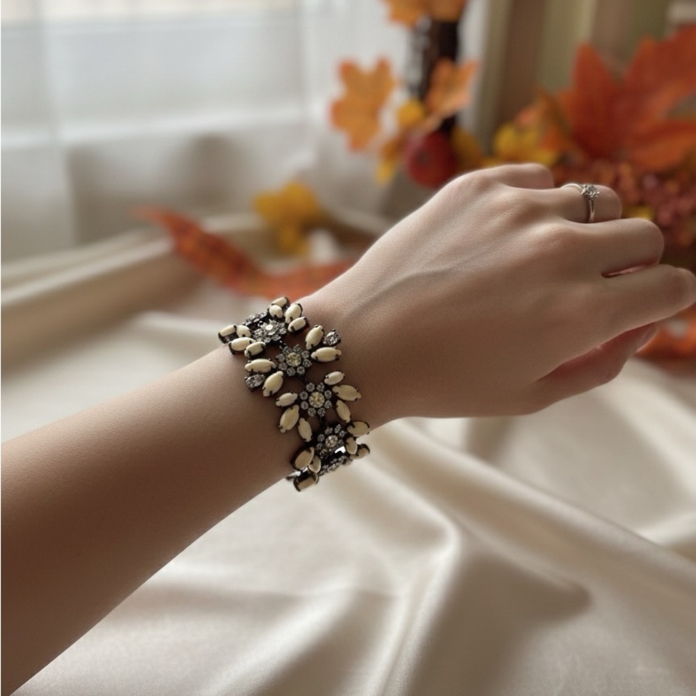 Juicy Couture Elegant Black and Cream Floral Bracelet